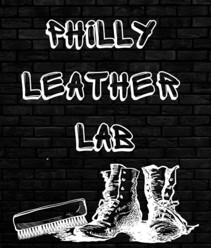 Black brick wall background with drawing of leather boots and boot brush and white graffitti style text reading PHILLY LEATHER LAB